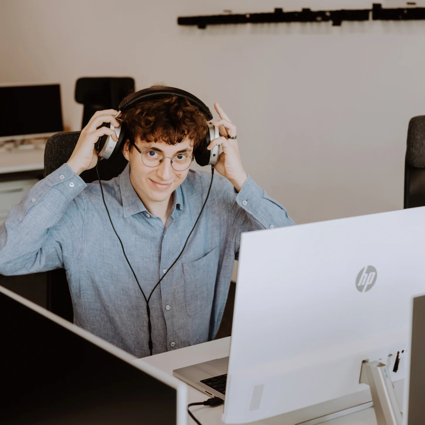 Team member working with headphones